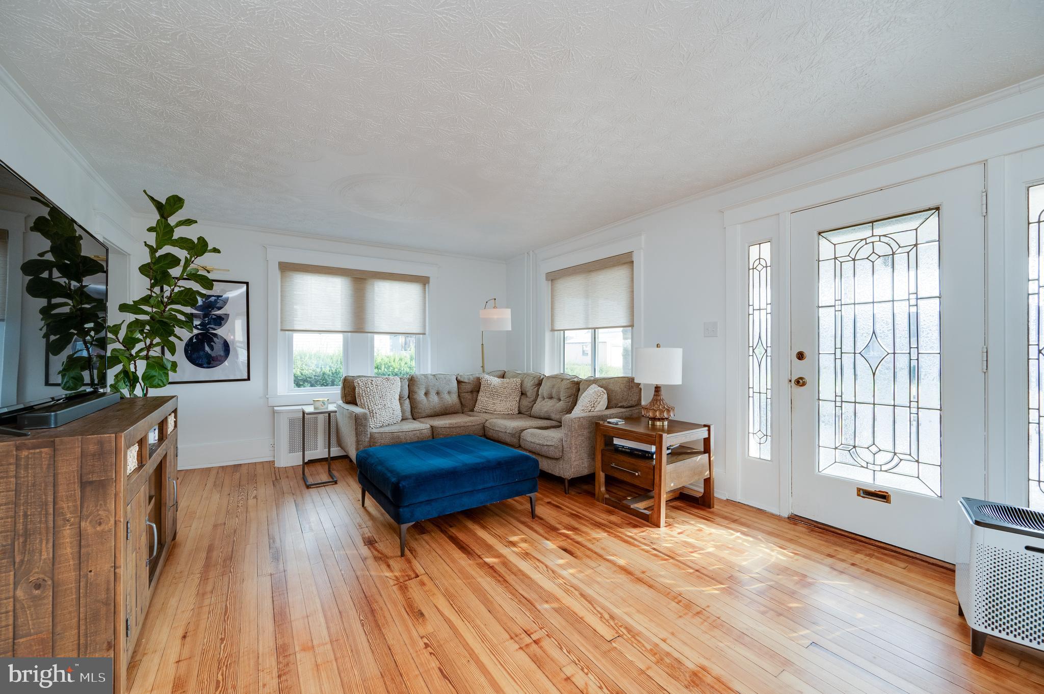 2021 Noble Street Reading, PA 19609 - Photo 8 of 54 a living room with furniture and a wooden floor