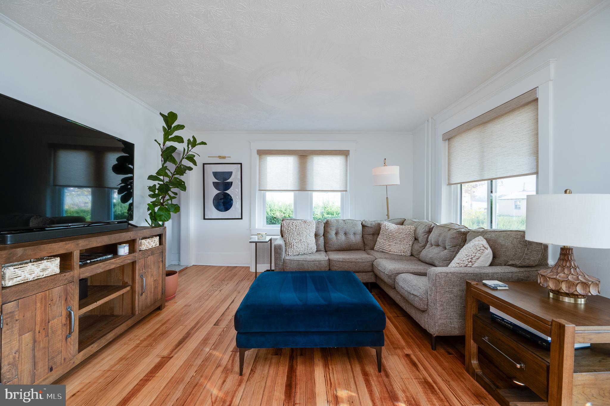 2021 Noble Street Reading, PA 19609 - Photo 9 of 54 a living room with furniture and a flat screen tv