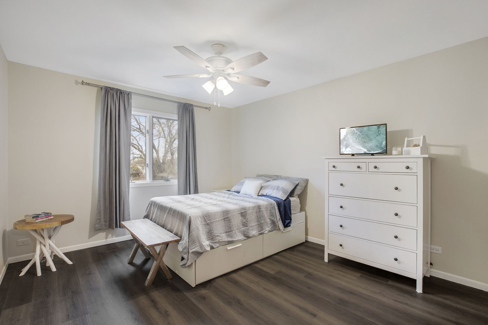 814 Roger Road Woodstock, IL 60098 - Photo 14 of 26 a bedroom with a bed and a dresser