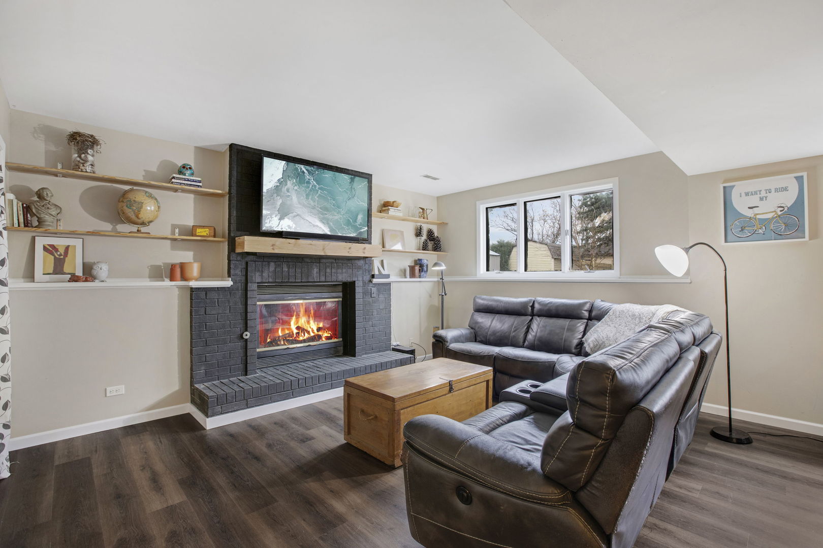 814 Roger Road Woodstock, IL 60098 - Photo 17 of 26 a living room with furniture and a fireplace