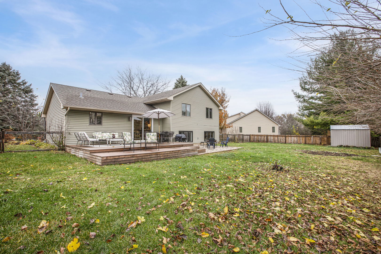 814 Roger Road Woodstock, IL 60098 - Photo 22 of 26 a front view of a house with garden