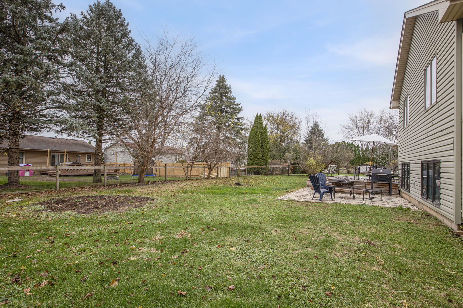 814 Roger Road Woodstock, IL 60098 - Photo 24 of 26 a view of a house with a back yard