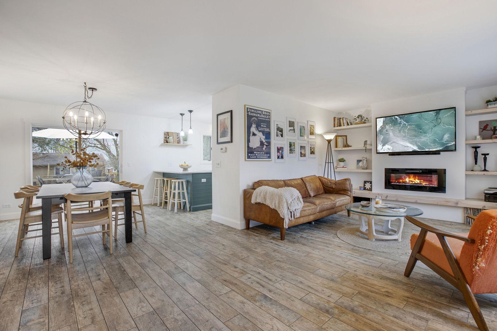 814 Roger Road Woodstock, IL 60098 - Photo 3 of 26 a bedroom with a bed and wooden floor