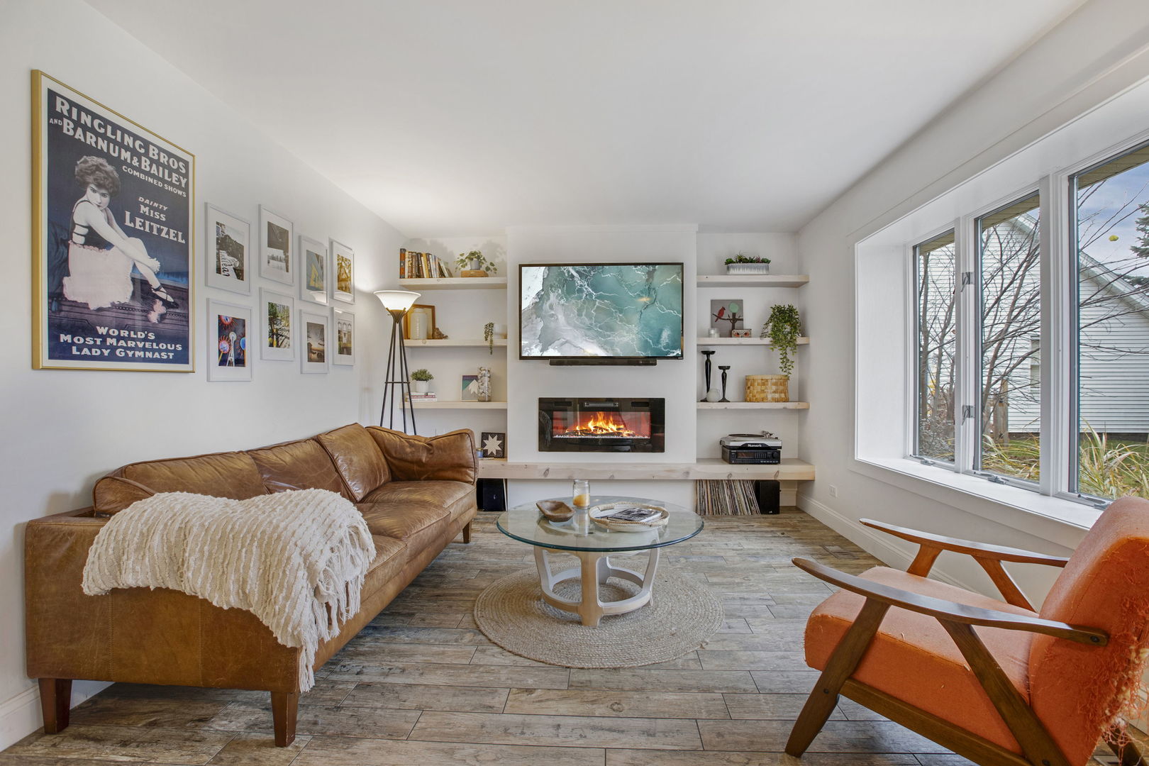 814 Roger Road Woodstock, IL 60098 - Photo 4 of 26 a living room with furniture and a flat screen tv
