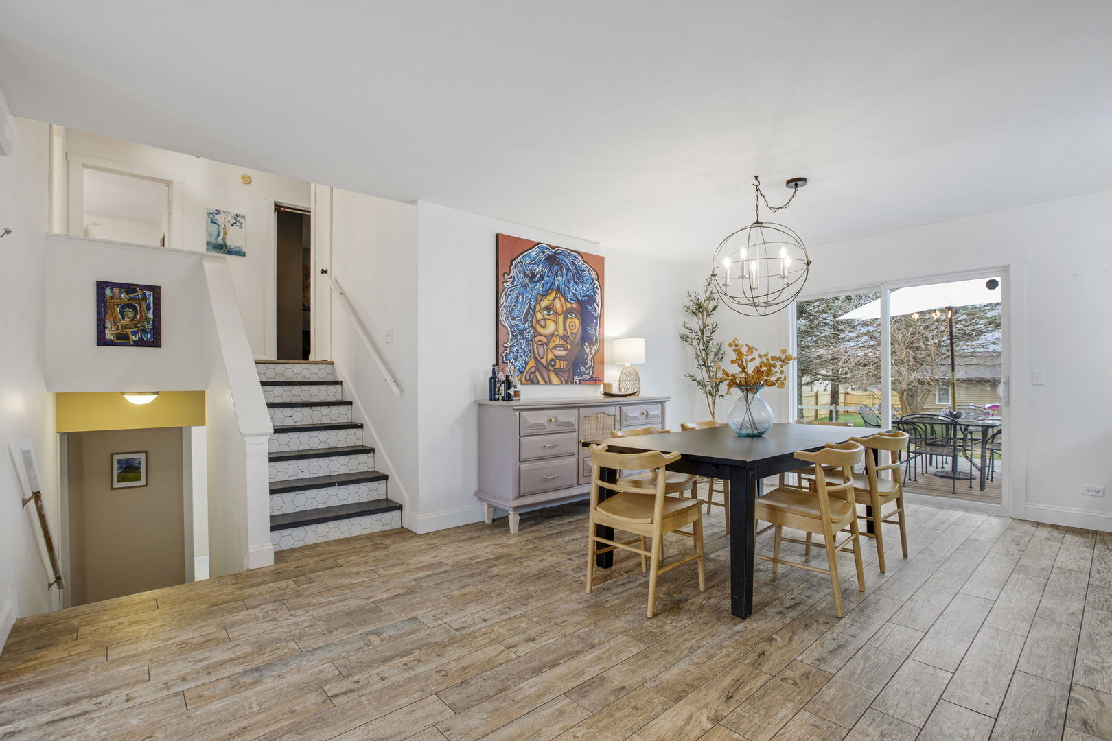 814 Roger Road Woodstock, IL 60098 - Photo 6 of 26 a view of a dining room with furniture and wooden floor