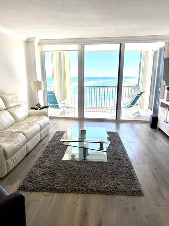 a living room with furniture and a large window