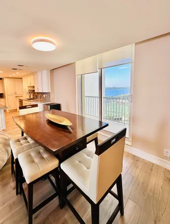 a living room with a table and chairs