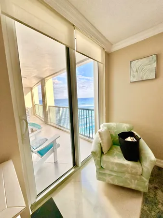 a bathroom with a granite countertop sink a toilet a mirror and shower