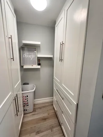 a bathroom with a double vanity sink toilet and shower