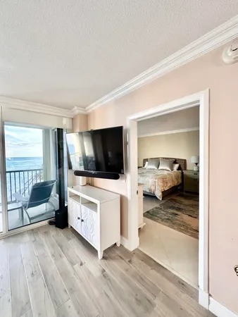 a bedroom with a bed and a night stand
