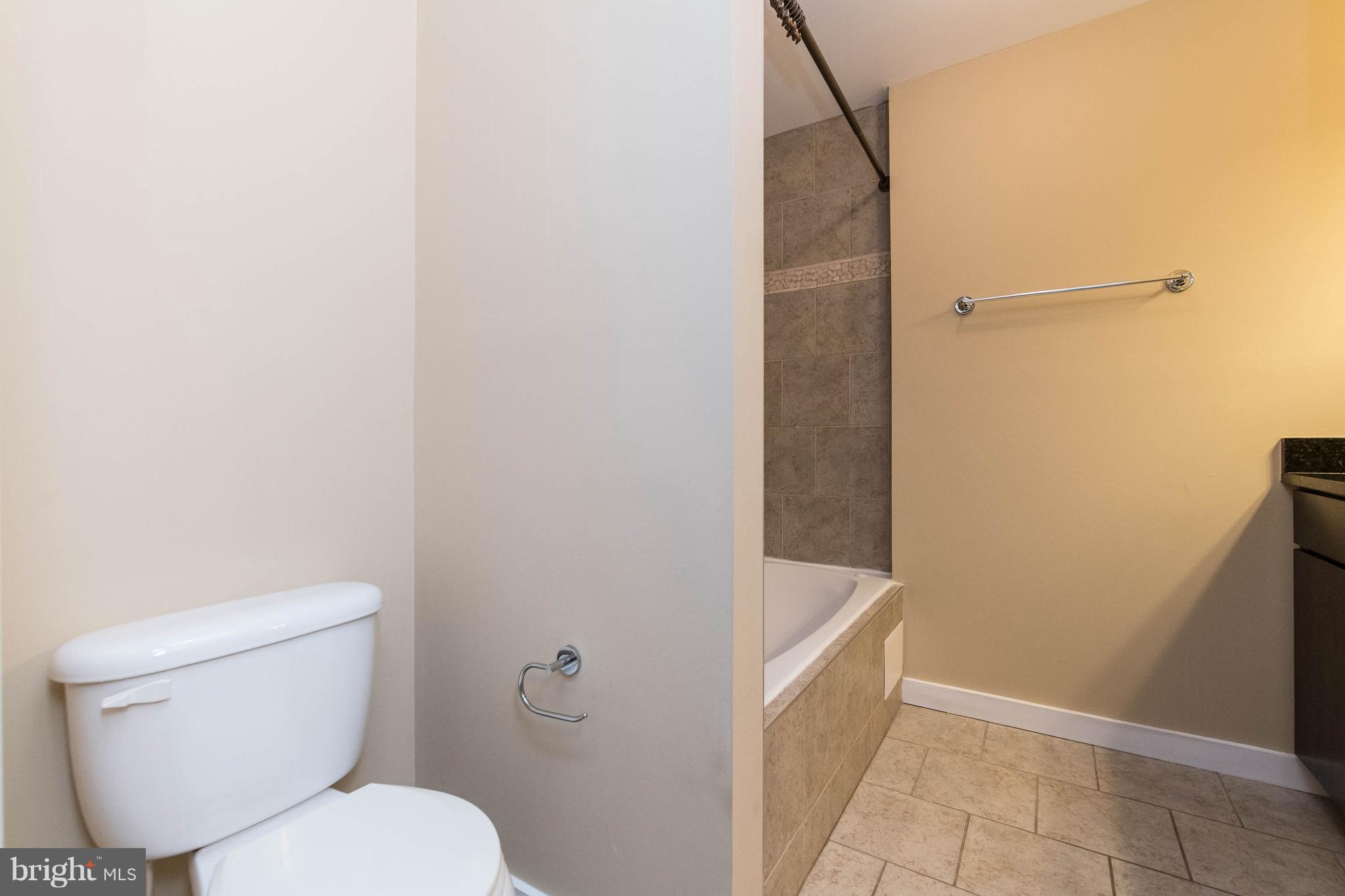 314 West 28th Street Baltimore, MD 21211 - Photo 16 of 27 a white toilet sitting next to a shower