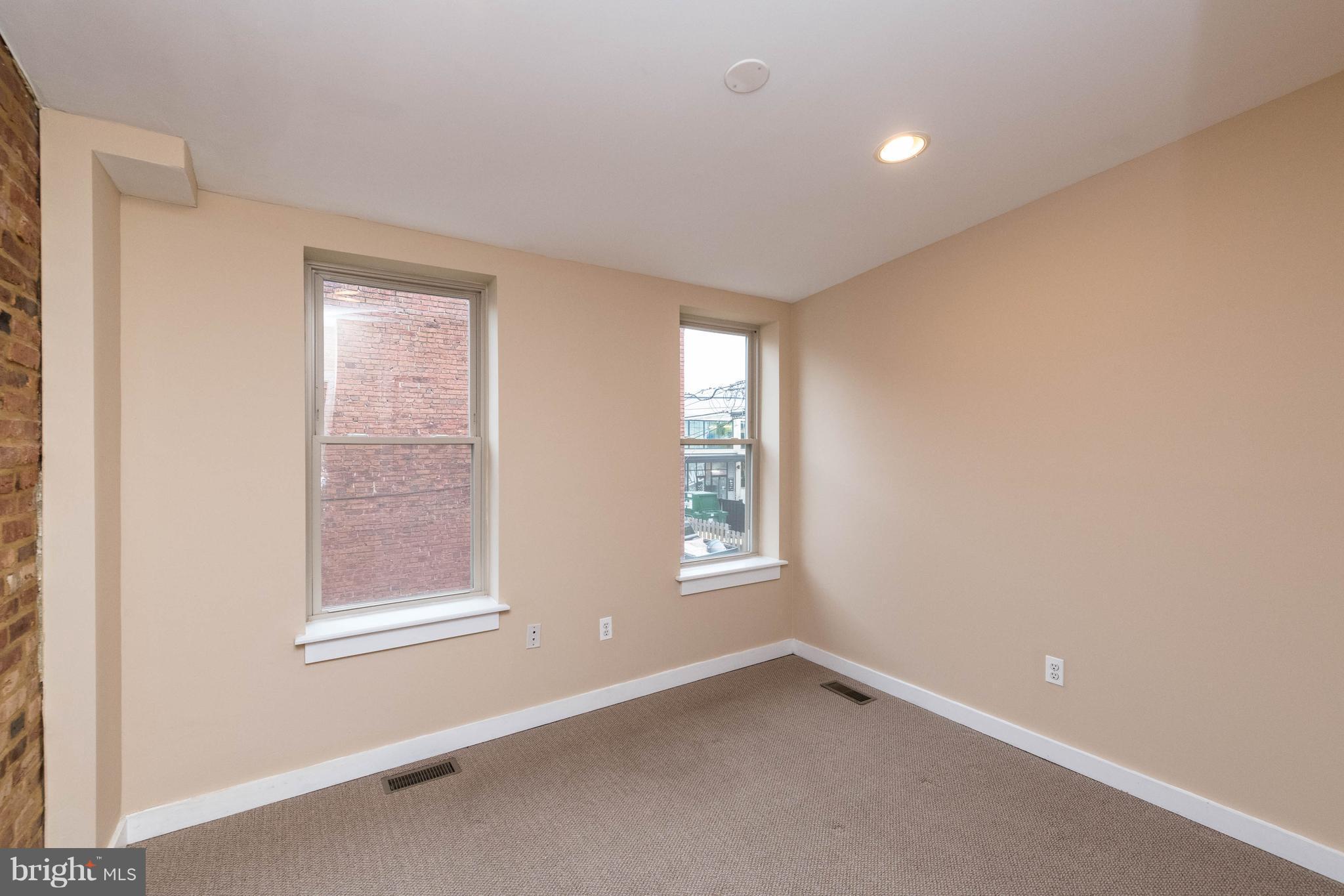 314 West 28th Street Baltimore, MD 21211 - Photo 18 of 27 an empty room with a window