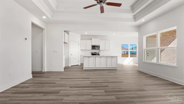 a view of kitchen with wooden floor and window