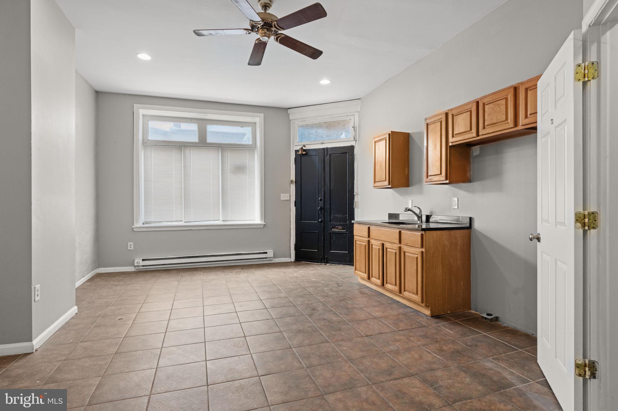 1901 East Venango Street Philadelphia, PA 19134 - Photo 11 of 29 a view of a kitchen with a sink and a refrigerator