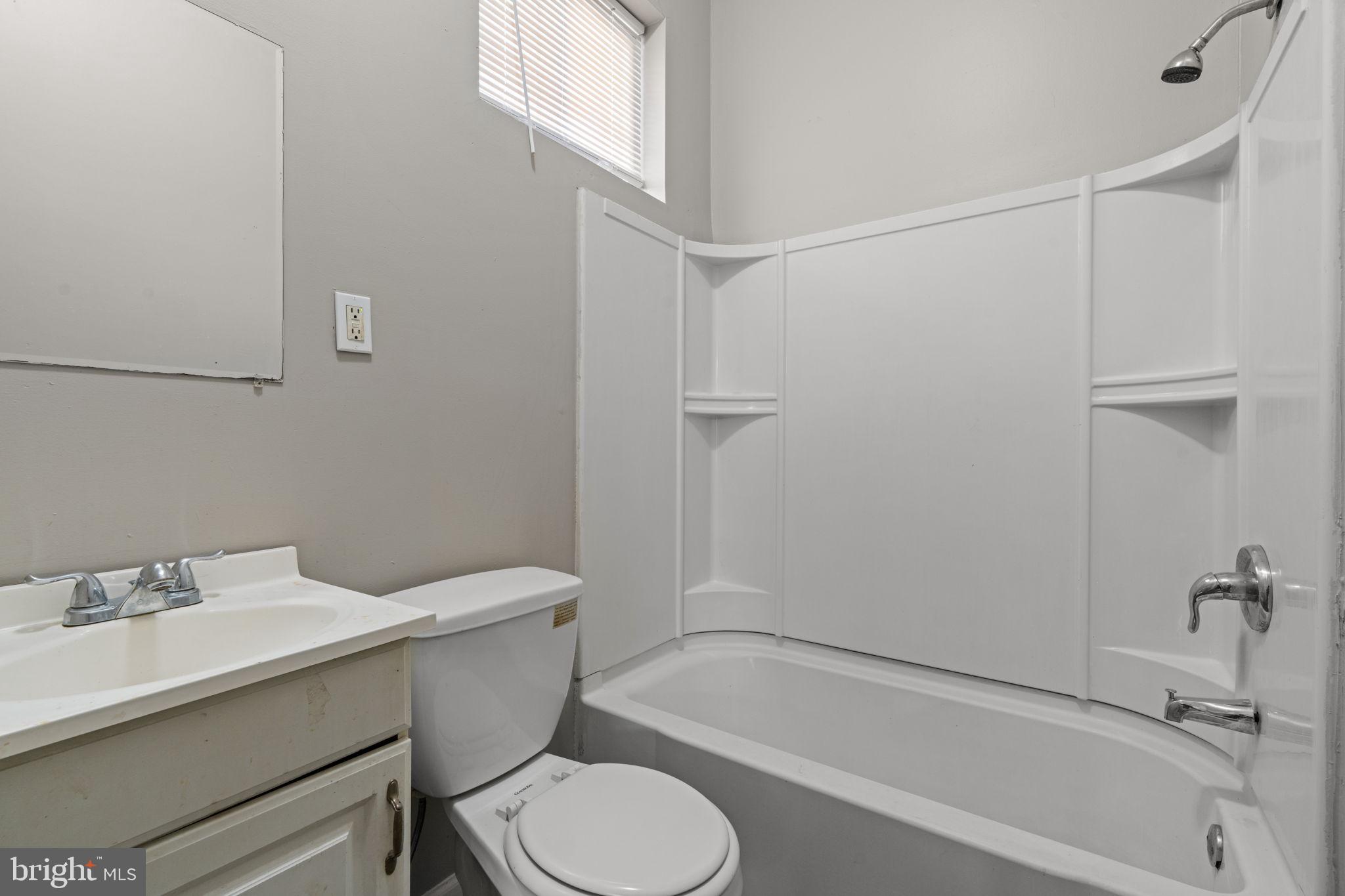 1901 East Venango Street Philadelphia, PA 19134 - Photo 16 of 29 a bathroom with a sink toilet and shower