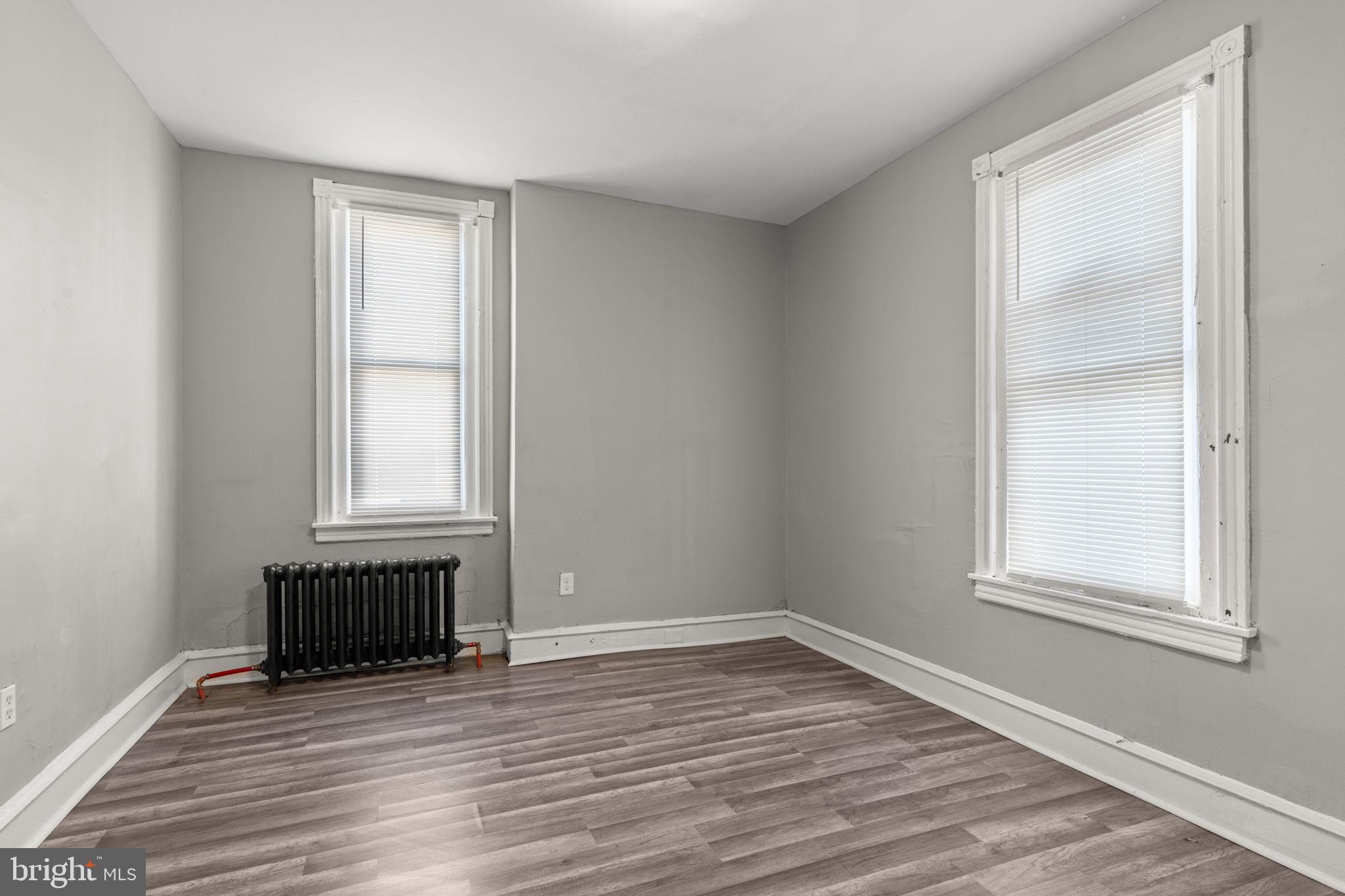 1901 East Venango Street Philadelphia, PA 19134 - Photo 23 of 29 an empty room with wooden floor and windows
