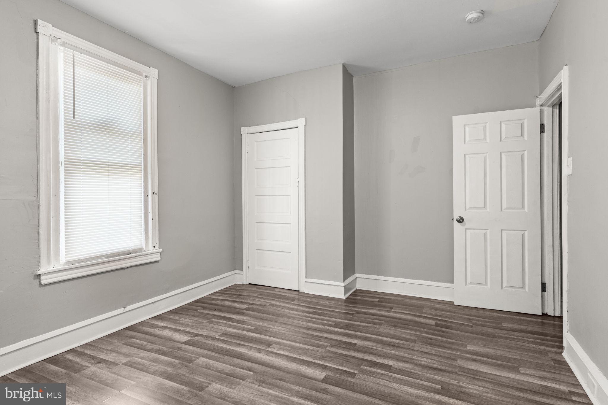 1901 East Venango Street Philadelphia, PA 19134 - Photo 24 of 29 an empty room with wooden floor and windows