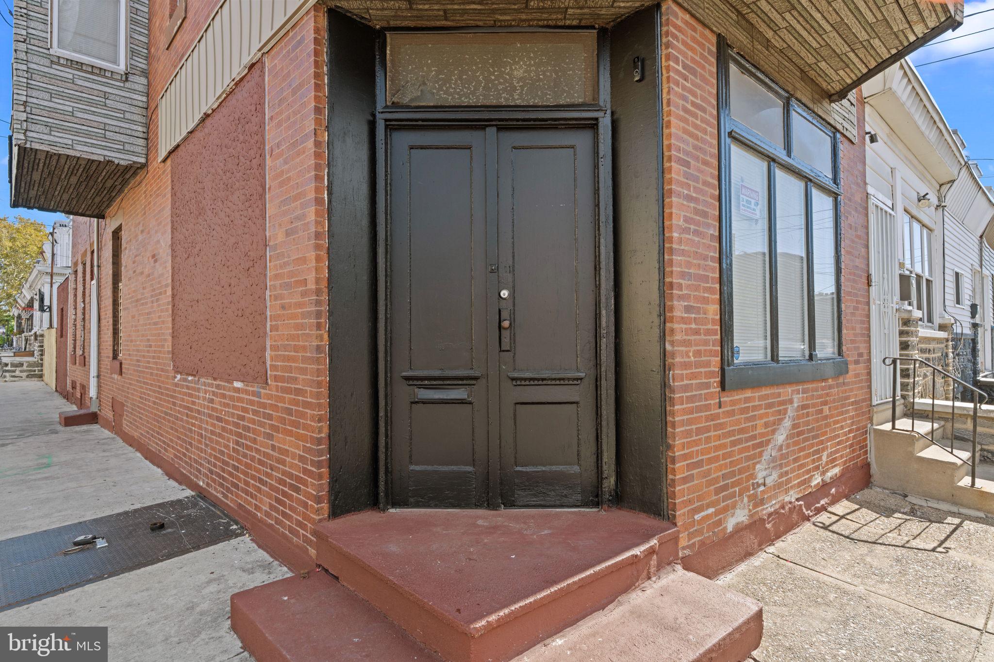 1901 East Venango Street Philadelphia, PA 19134 - Photo 3 of 29 a view of a brick house with a door