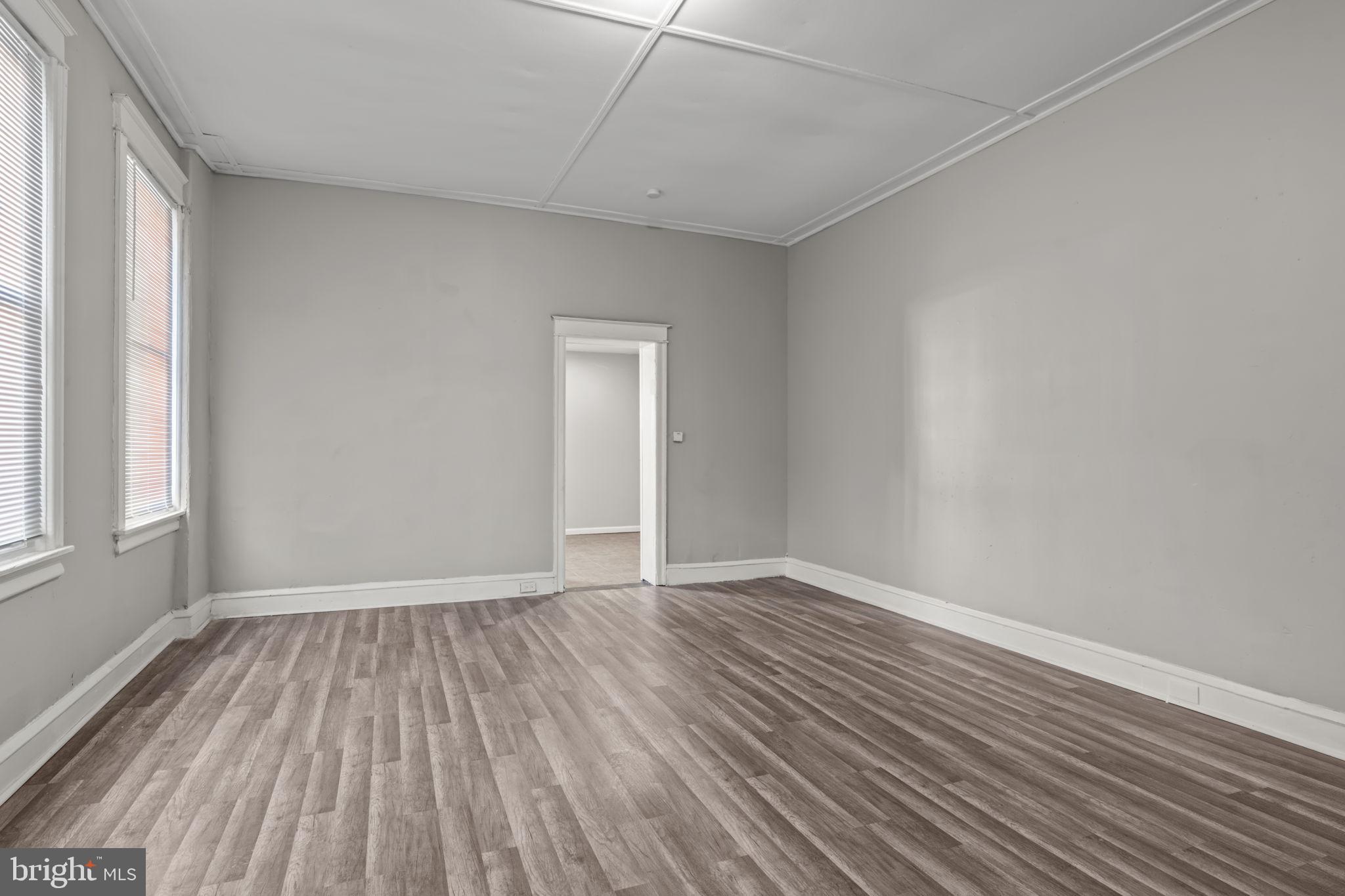 1901 East Venango Street Philadelphia, PA 19134 - Photo 5 of 29 a view of an empty room with wooden floor and a window