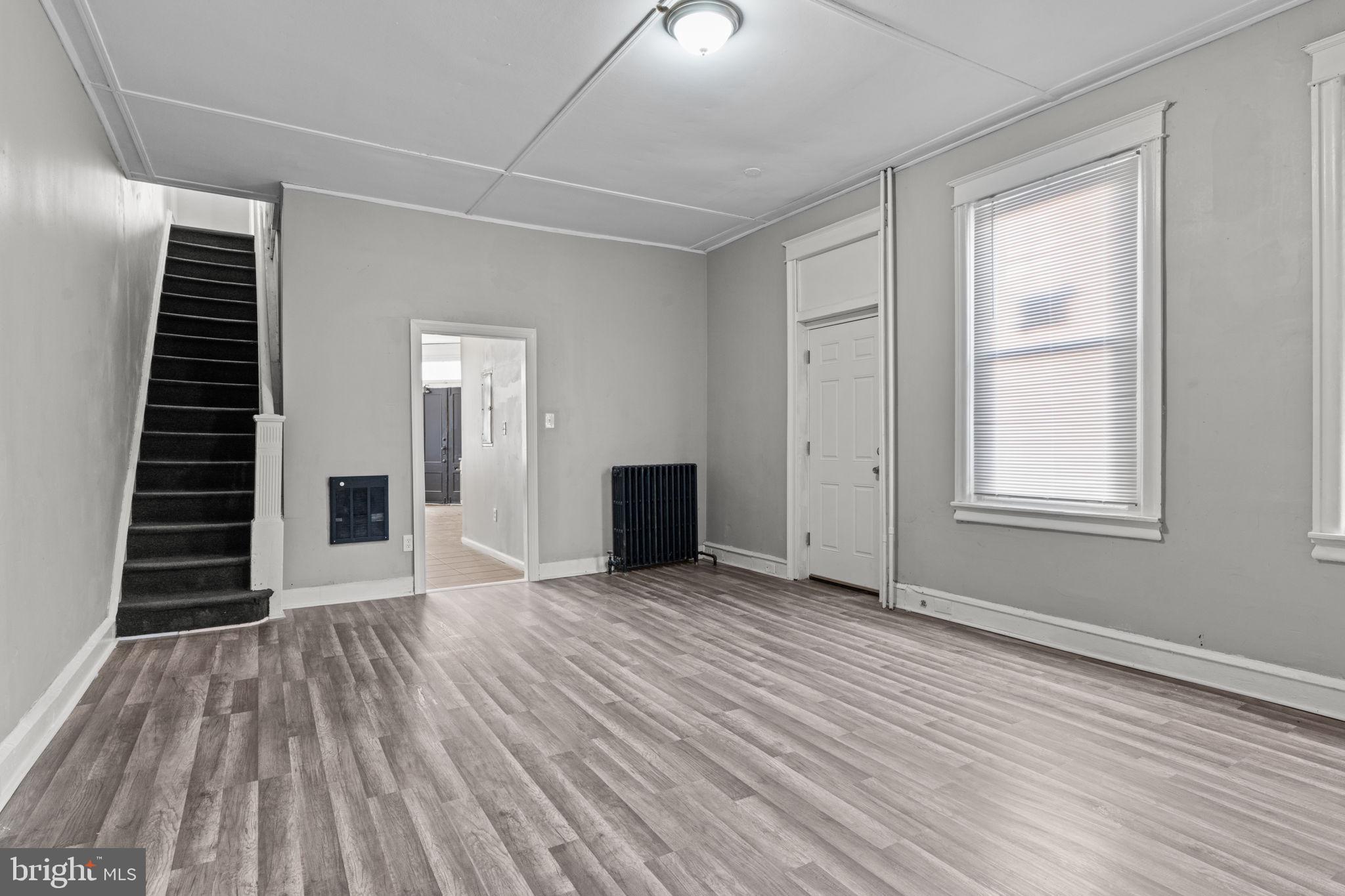 1901 East Venango Street Philadelphia, PA 19134 - Photo 7 of 29 a view of an empty room with wooden floor and a window