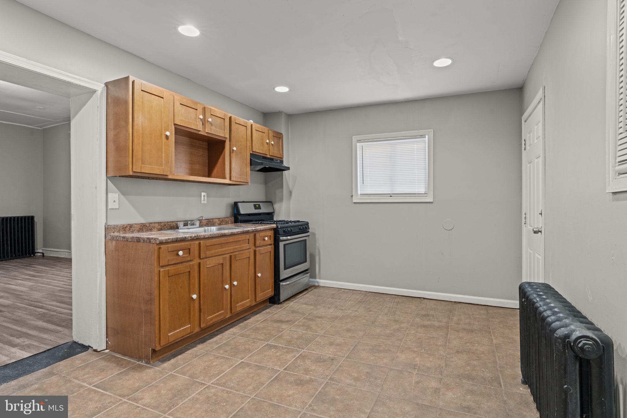 1901 East Venango Street Philadelphia, PA 19134 - Photo 8 of 29 a kitchen with stainless steel appliances granite countertop a stove and a microwave