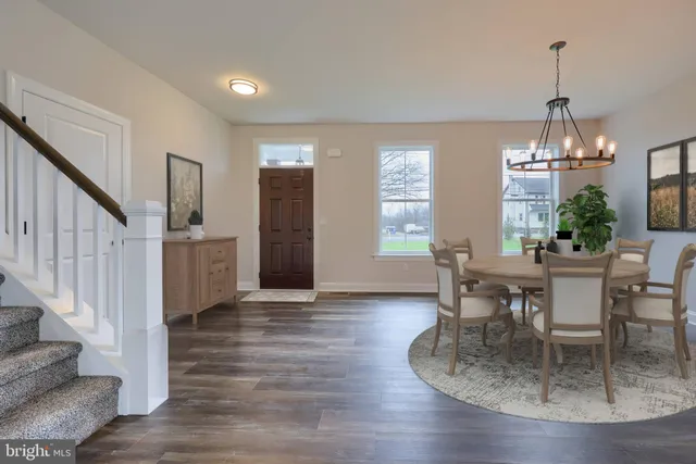 a view of a livingroom with furniture window and wooden floor