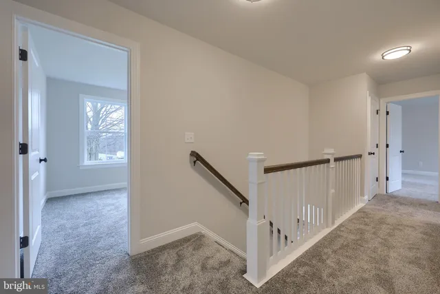 a view of a hallway with staircase