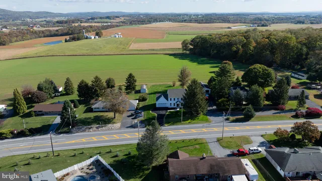 a view of a lake with couches and city view