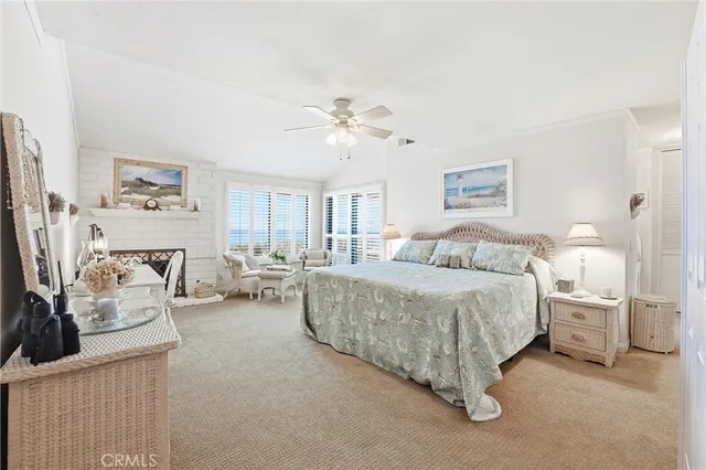 a spacious bedroom with a bed and a couch