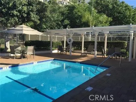 a view of a swimming pool with a patio