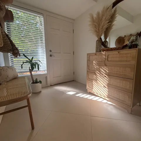 a kitchen with a dining table chairs and window