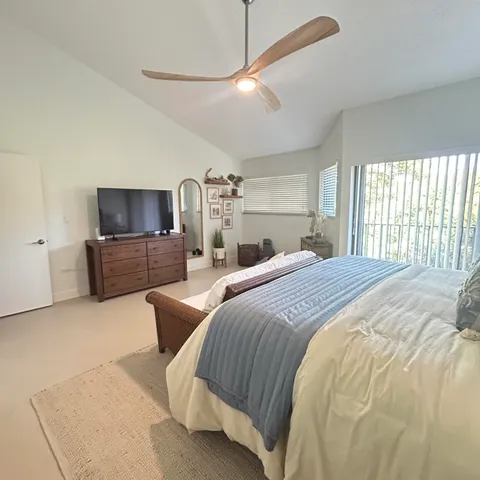 a bedroom with a bed and a couch