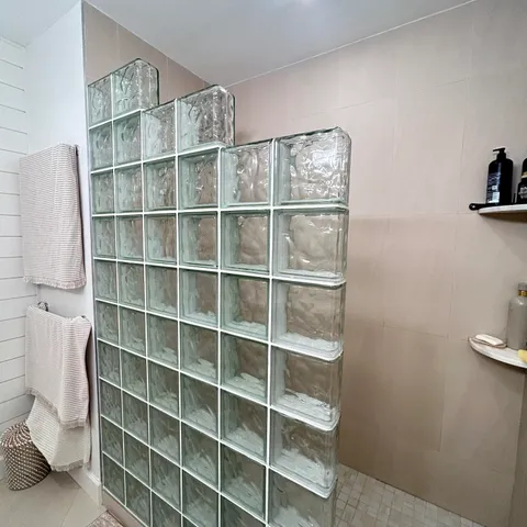 a bathroom with a sink a toilet and shower curtain