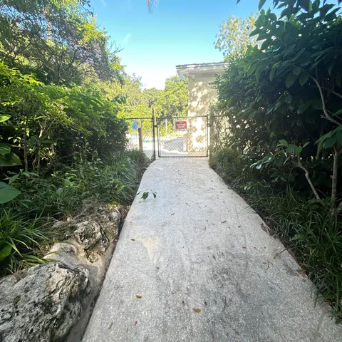 a living room with furniture and a mirror