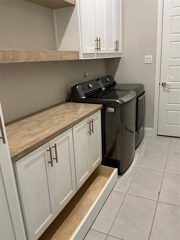 2195 English Ivy Road Frisco, TX 75033 - Photo 7 of 23 Custom Cabinetry added to the laundry room, with side and overhead storage as well.