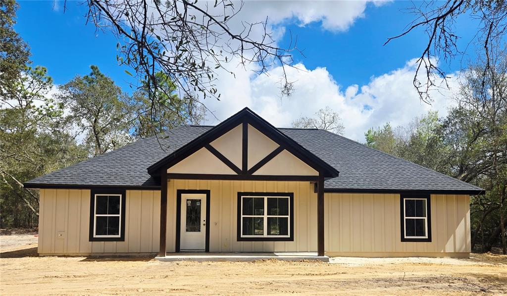 8541 Northeast 105th Avenue Bronson, FL 32621 - Photo 1 of 20 a front view of a house with a yard