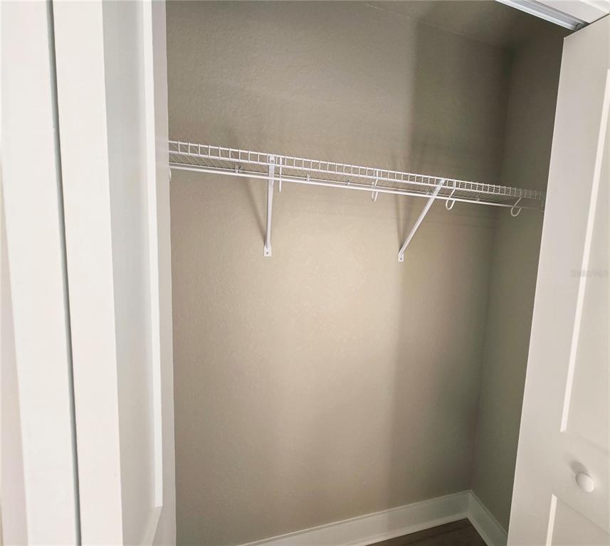 8541 Northeast 105th Avenue Bronson, FL 32621 - Photo 12 of 20 a view of a room with racks on the wall