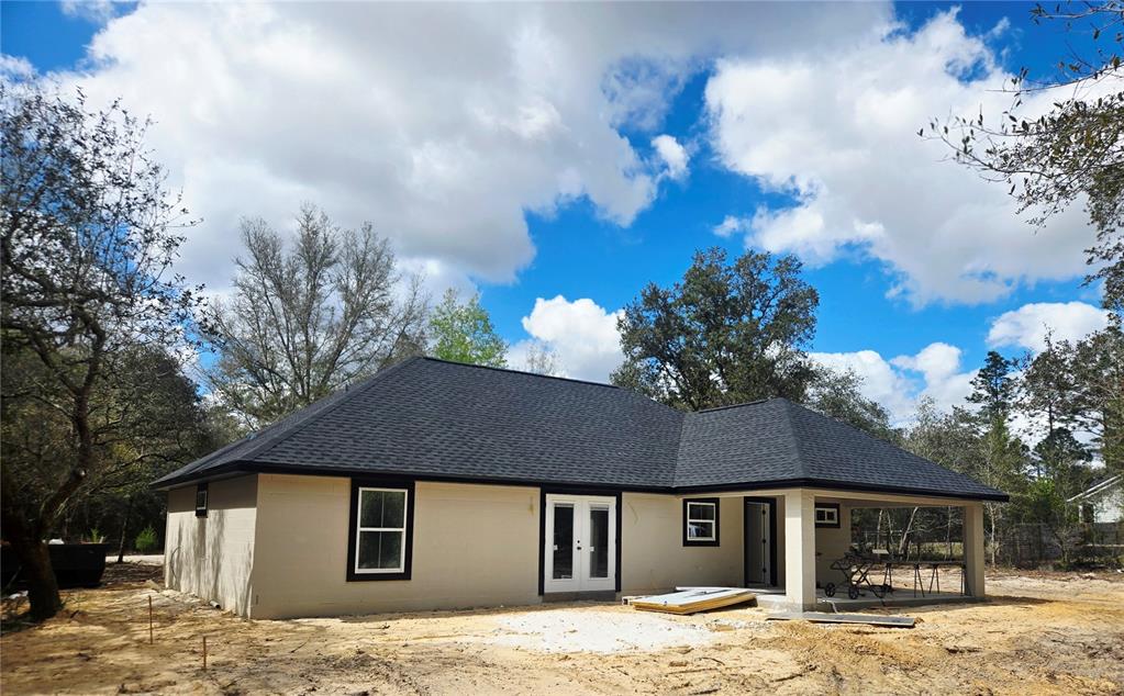 8541 Northeast 105th Avenue Bronson, FL 32621 - Photo 4 of 20 a front view of a house with a yard