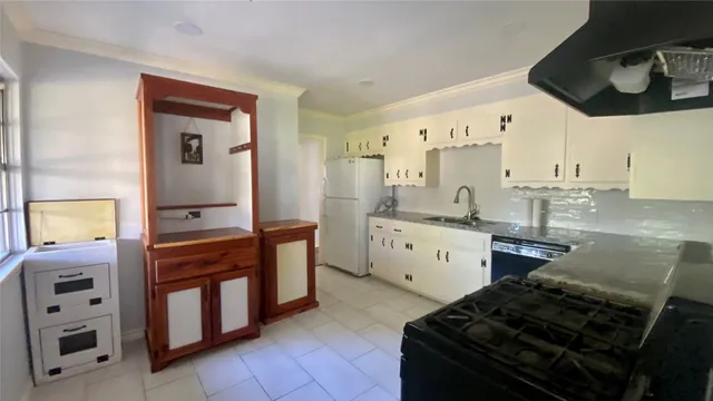 a kitchen with a stove and a sink