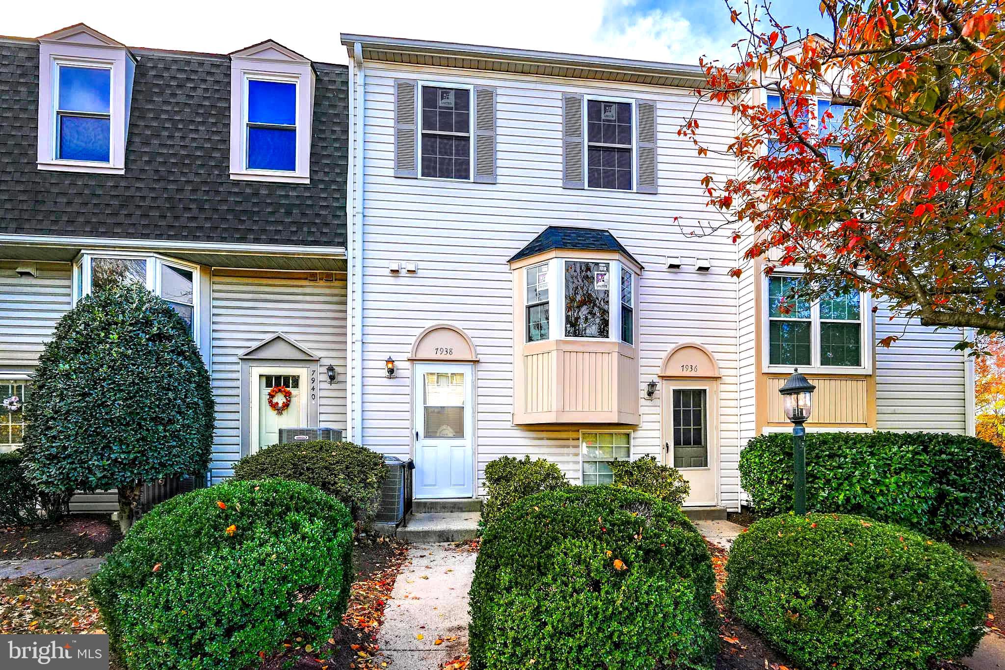 7938 Brighton Way Manassas, VA 20109 - Photo 1 of 26 a front view of a house with plants and trees
