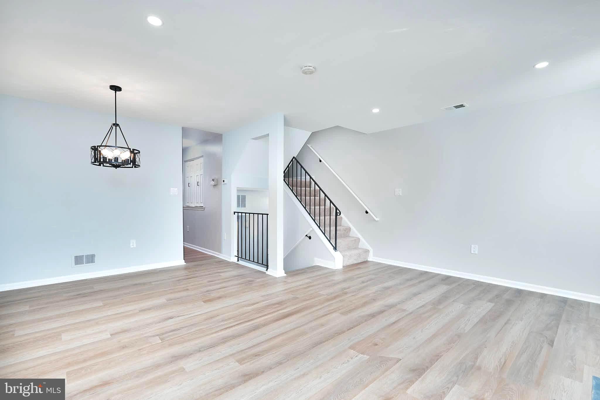 7938 Brighton Way Manassas, VA 20109 - Photo 6 of 26 a view of empty room with wooden floor