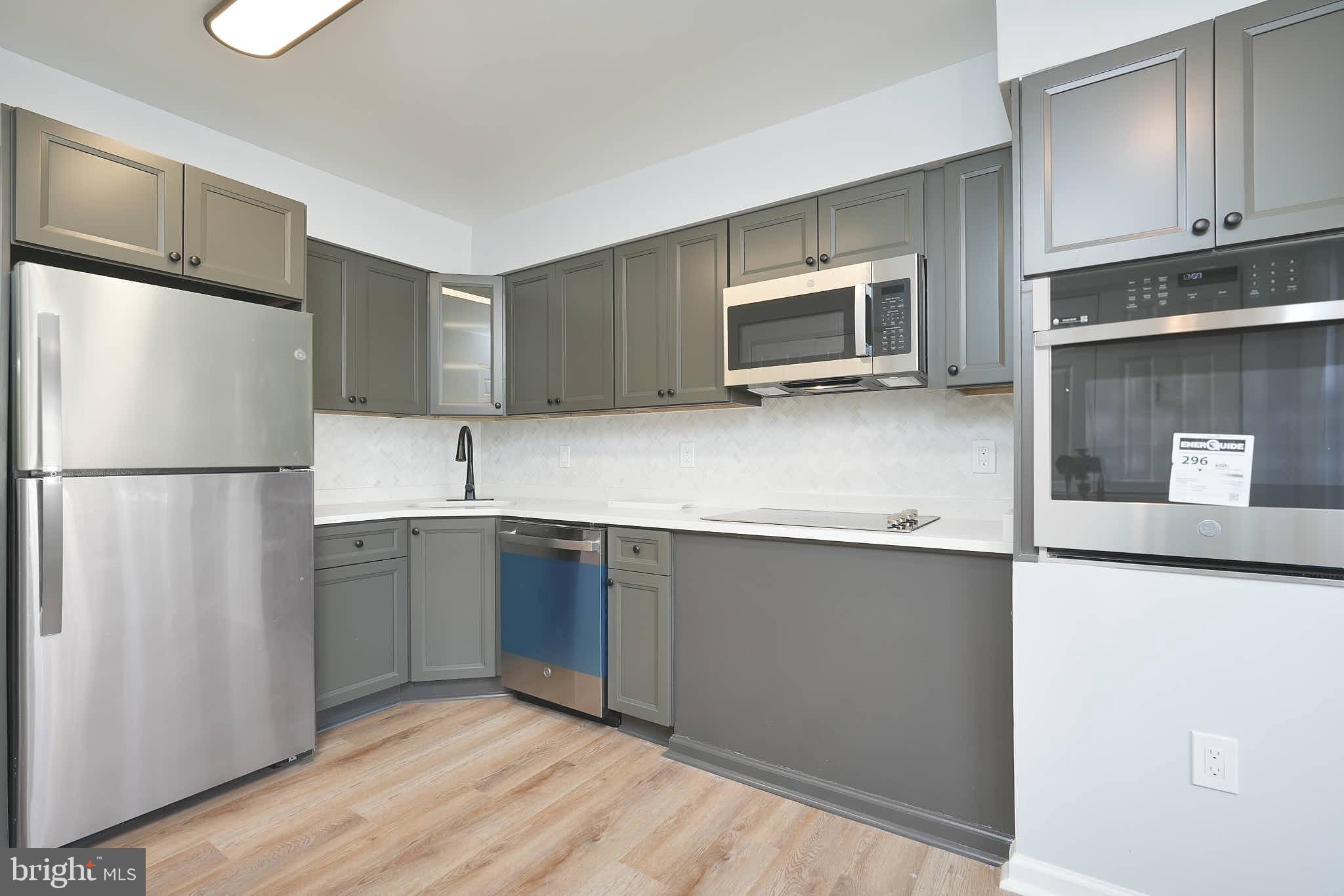 7938 Brighton Way Manassas, VA 20109 - Photo 10 of 26 a kitchen with stainless steel appliances a refrigerator sink and microwave