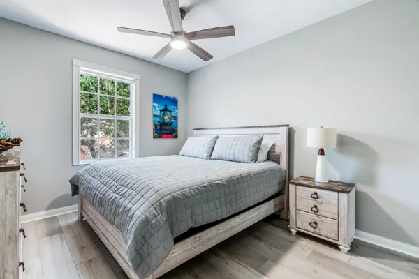 a bedroom with a large bed and a tv on a dresser