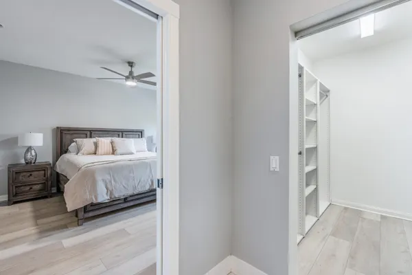 a bedroom with a bed and a walk in closet