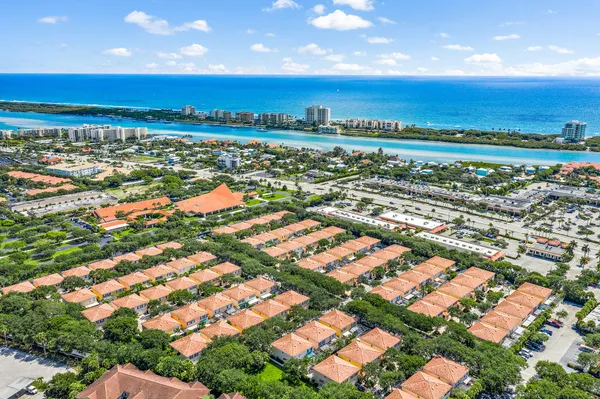 an aerial view of residential building with outdoor space and street view