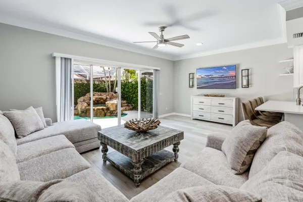 a living room with furniture and a large window