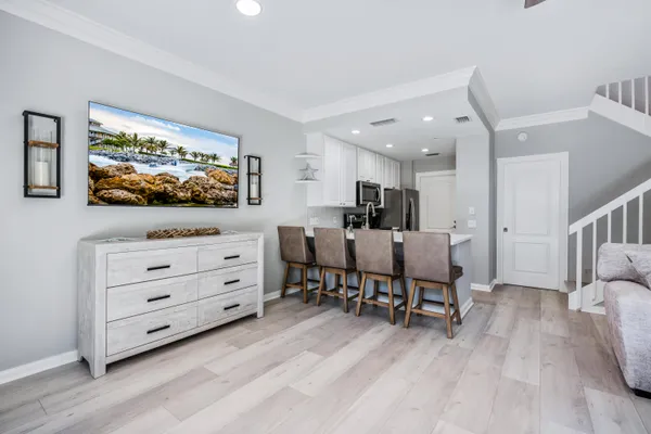 a view of a livingroom with furniture and a flat screen tv