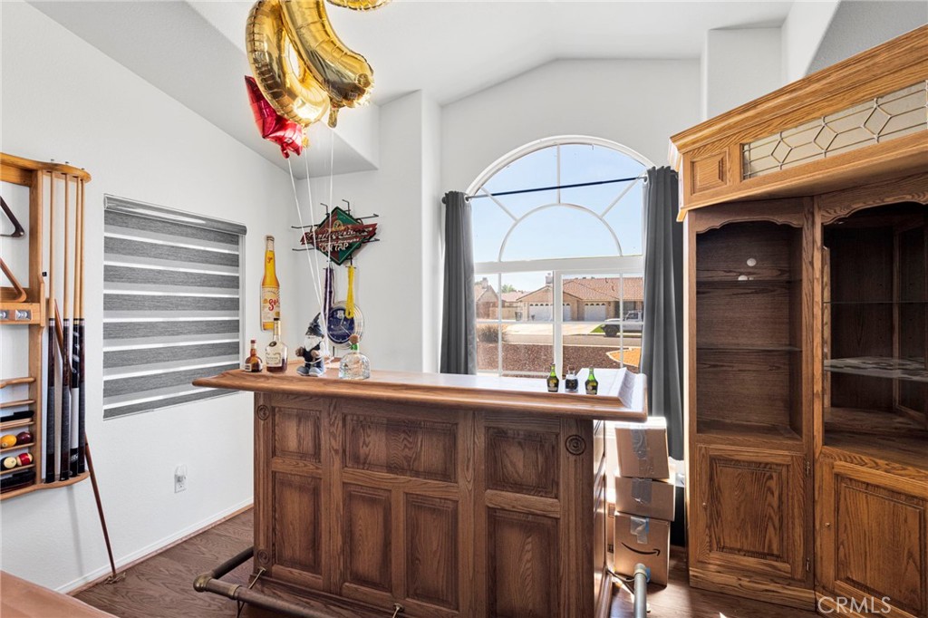 13863 Coachella Road Apple Valley, CA 92307 - Photo 11 of 53 a view of a fireplace and a windows in a room