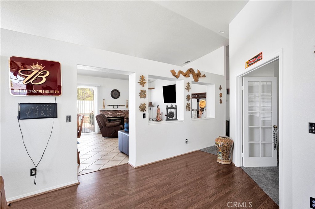 13863 Coachella Road Apple Valley, CA 92307 - Photo 13 of 53 a view of livingroom with furniture and wooden floor