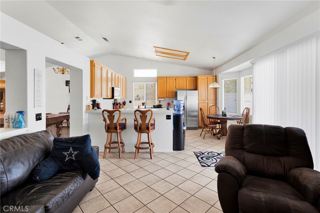 13863 Coachella Road Apple Valley, CA 92307 - Photo 17 of 53 a living room with furniture and a large window